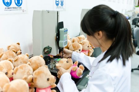 woman testing stuffed bears.