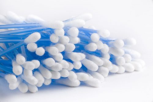 Cotton swabs on blue sticks isolated on a white