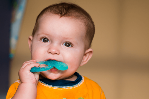 Baby Chewing On Teething Ring
