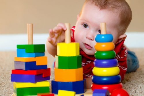bigstock Baby boy playing with stacking
